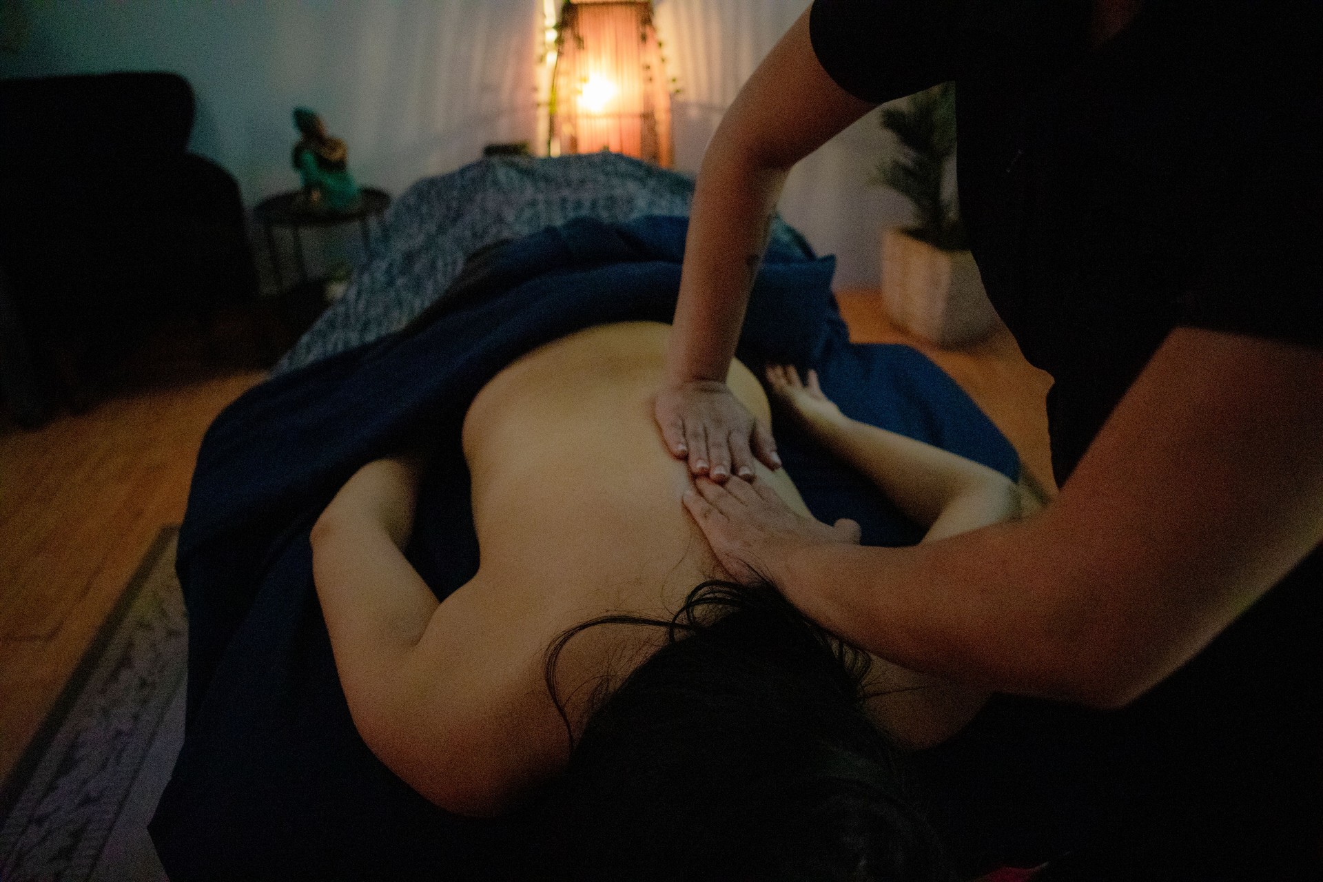 Masseuse massaging client