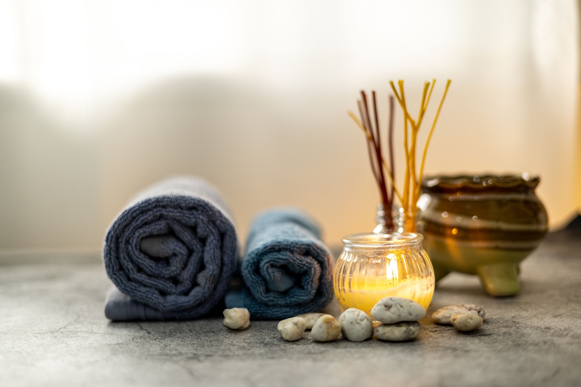 Spa set with scented candle, stone, aroma incense sticks and towels